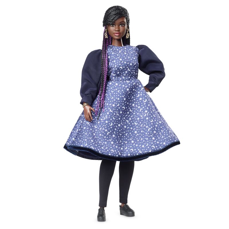 Dr Aderin-Pocock doll is wearing a starry blue dress and chunky earrings.