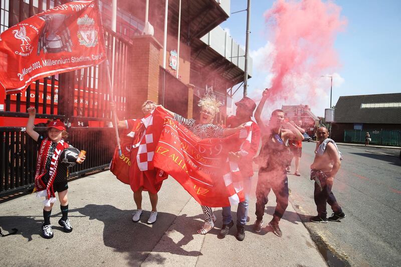 Liverpool fans celebrate outside Anfield on Friday, the second day of partying. PA