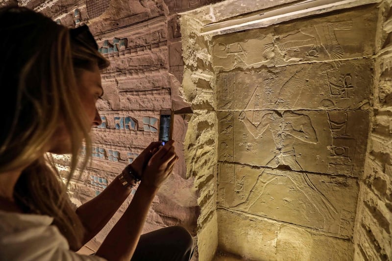 A tourist takes picture inside Djoser’s Step Pyramid. On Thursday, Egypt reopened the pyramid after a 14-year restoration that cost nearly $6.6 million. AFP