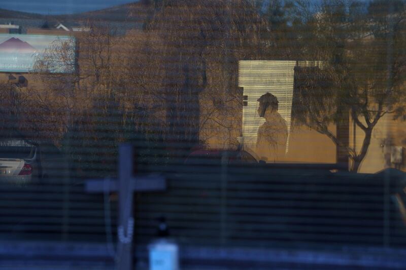 A medical worker is seen through a patient's window during a surge of coronavirus cases at Memorial Medical Centre in Las Cruces, New Mexico, US. Reuters
