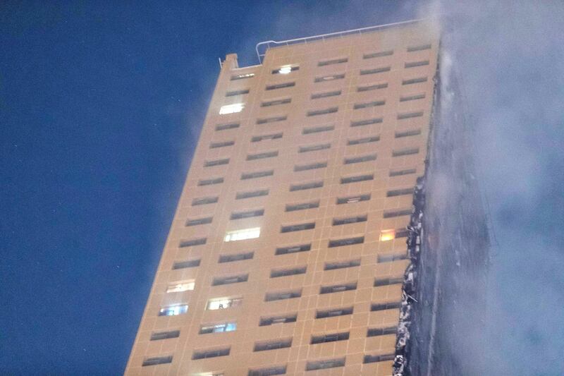 SHARJAH, UNITED ARAB EMIRATES. 05 MAY 2020. STANDALONE. Fire at the Abbco Tower near Nahda Park in Sharjah. Police and fire fighters responded to a blaze that was reported after 8:30. (Photo: Antonie Robertson/The National) Journalist: Salam Al Amir. Section: National.