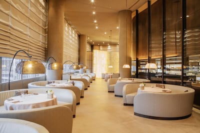 The circular restaurant has an illuminated wall at the back. Photo: Armani Hotel