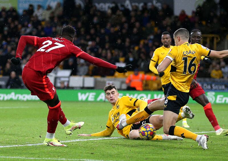 Liverpool's Divock Origi scores against Wolves. PA