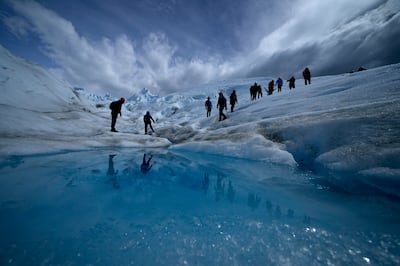 Tourists walk on the Perito Moreno Glacier at Los Glaciares National Park, near El Calafate, Argentina. AP Photo
