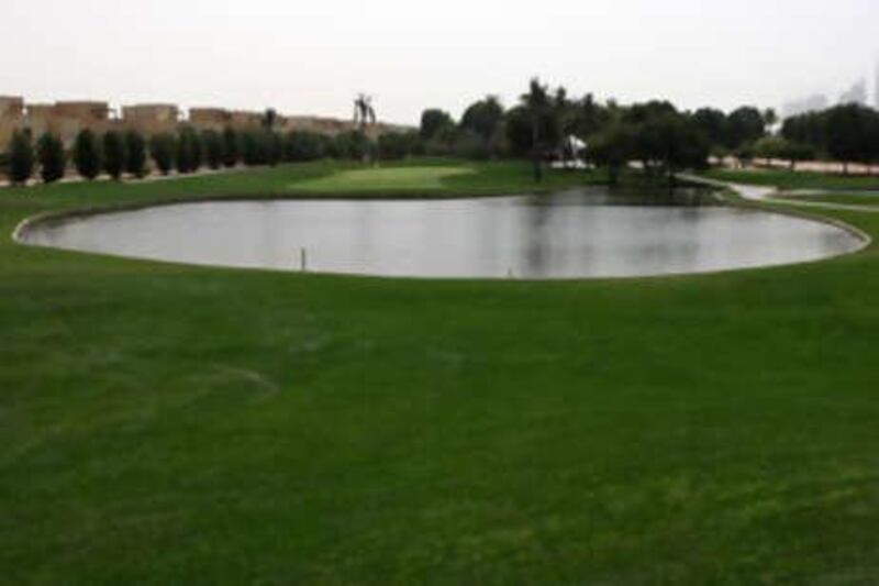 The fifth hole of the Majlis course at the Emirates Golf Club forces you to check your shot due to the large pond next to the green.