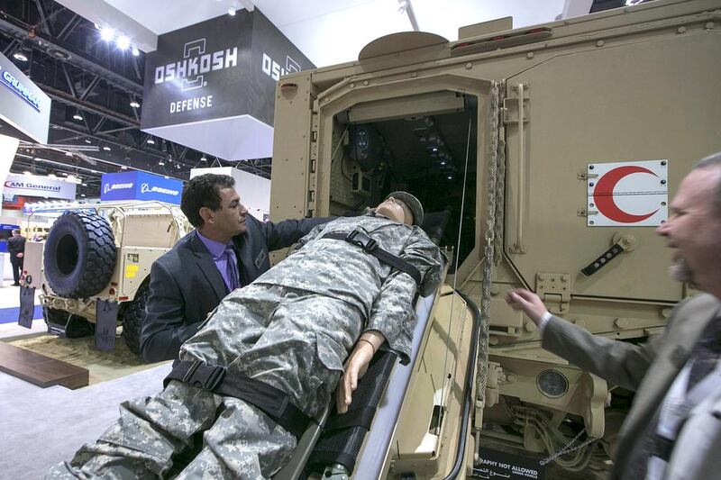 Oshkosh staff demonstrate the usage of an M-ATV ambulance variant at Idex 2015. Silvia Razgova / The National