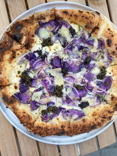 Dubai pizzeria Moon Slice has whipped up a pretty purple pie for Valentine's Day. Photo: Moon Slice