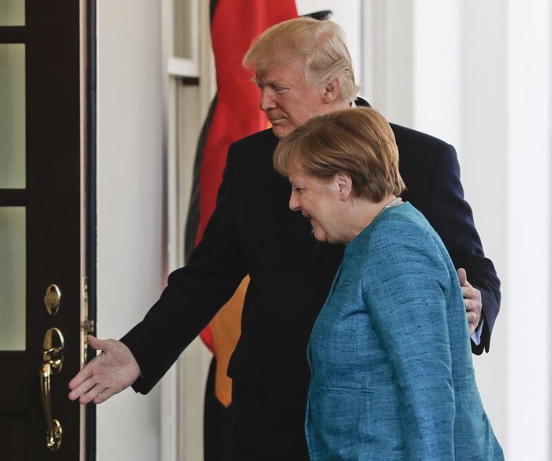 President Donald Trump welcomes German chancellor Angela Merkel outside the West Wing of the White House in Washington on March 17, 2017. Pablo Martinez Monsivais / AP Photo