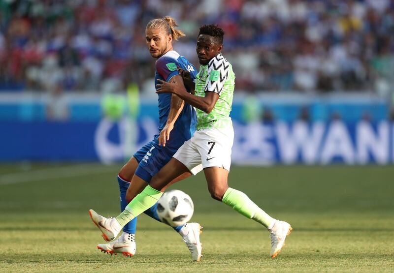 Iceland's Rurik Gislason challenges Nigeria's Ahmed Musa for the ball. Catherine Ivill / Getty Images