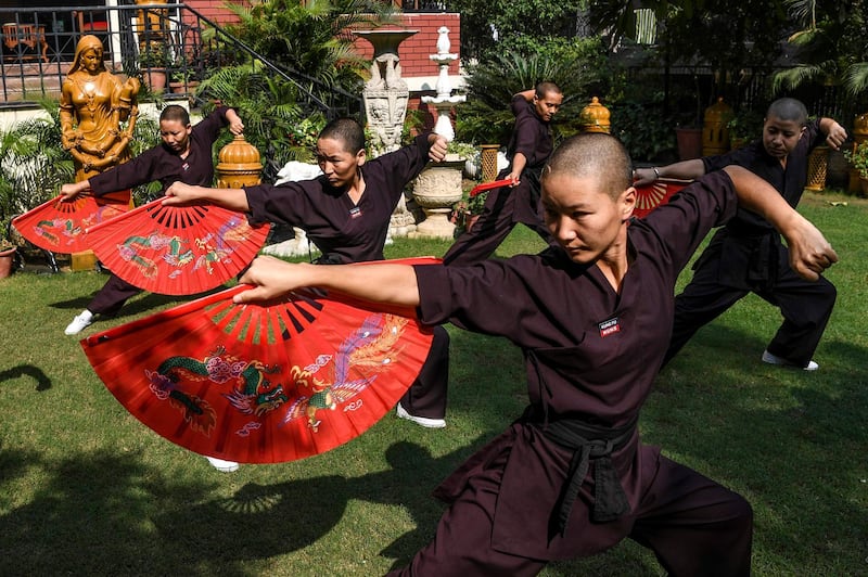 Members of the Kung Fu Nuns group demonstrate their skills in New Delhi.
