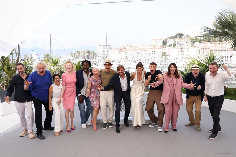 The cast and crew, including Dean and fellow actors Woody Harrelson and Harris Dickinson, at the festival in the South of France. AP