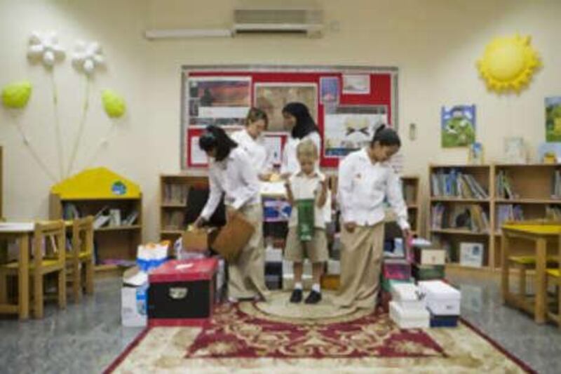 Al Shohub school pupils with donations. From left, Sana Kamall, Jana Van Zyl, Sanaa Sheikh, Joseph Moore and Salama al Suweidi.