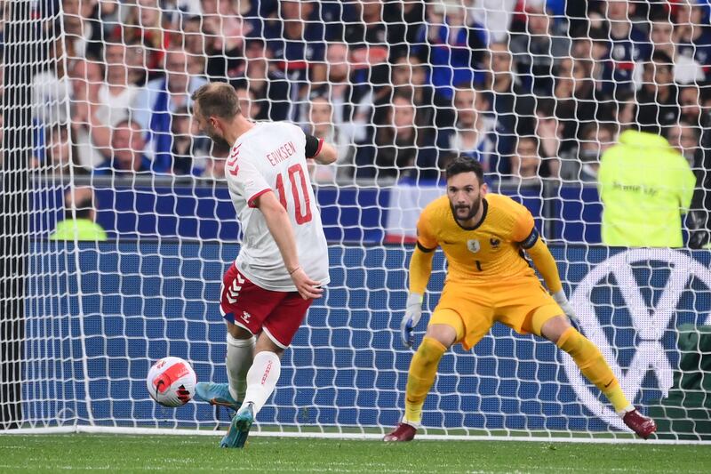 France goalkeeper Hugo Lloris saves a shot by Denmark's Christian Eriksen during the Nations League - League A Group 1 match at the Stade de France in Saint-Denis, north of Paris, on June 3, 2022.  AFP