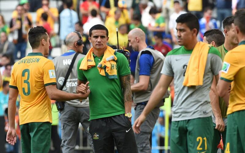Australia defender Jason Davidson, left, shakes hands with forward Tim Cahill after the Group B match against Spain at the Baixada Arena in Curitiba during the 2014 Fifa World Cup on June 23, 2014. William West / AFP