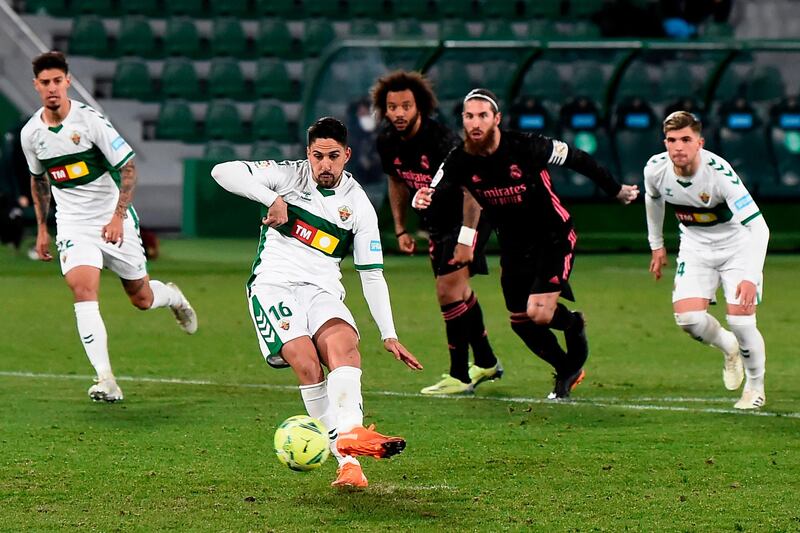 Elche's Spanish midfielder Fidel Chaves scores a penalty. AFP