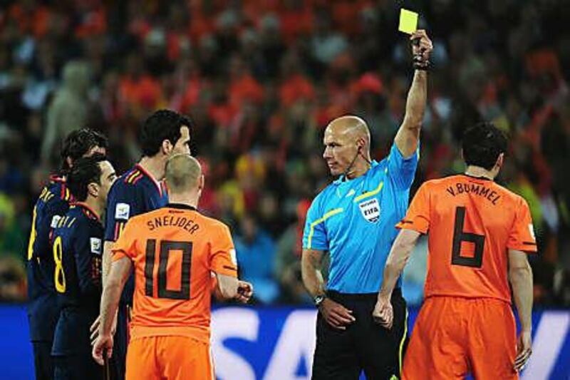 Eye of the storm: Howard Webb produced 13 yellow cards and one red card during the World Cup final.