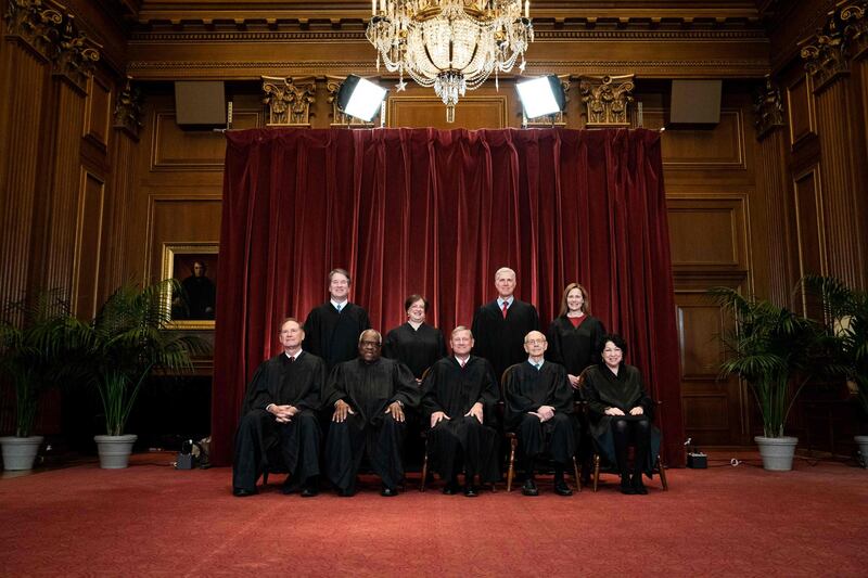 Seated from left: Associate Justice Samuel Alito, Associate Justice Clarence Thomas, Chief Justice John Roberts, Associate Justice Stephen Breyer and Associate Justice Sonia Sotomayor, standing from left: Associate Justice Brett Kavanaugh, Associate Justice Elena Kagan, Associate Justice Neil Gorsuch and Associate Justice Amy Coney Barrett pose during a group photo of the Justices at the Supreme Court in Washington, DC. AFP