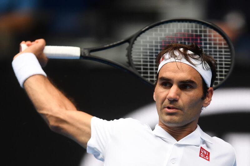 epa07288548 Roger Federer of Switzerland in action against Daniel Evans of Britain during their second round men's singles match at the Australian Open Grand Slam tennis tournament in Melbourne, Australia, 16 January 2019.  EPA/LUKAS COCH AUSTRALIA AND NEW ZEALAND OUT