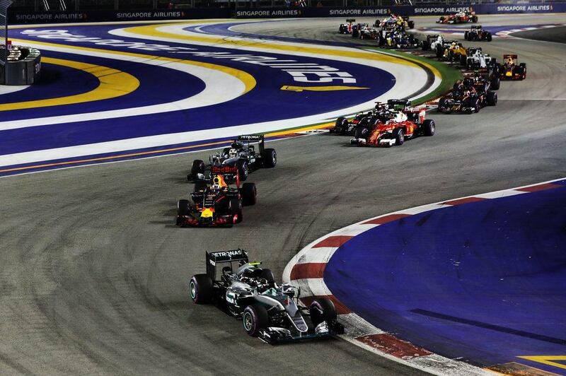 Nico Rosberg of Mercedes turbo leads Daniel Ricciardo of Red Bull at the start during the Formula One Singapore Grand Prix. Mark Thompson / Getty Images
