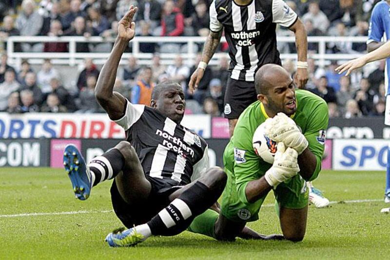 Ali Al Habsi, Wigan's Omani goalkeeper, denies the Newcastle striker Demba Ba during their 1-0 defeat at St James' Park.

Graham Stuart / AFP