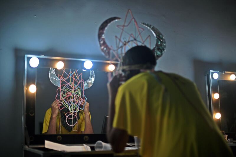 A performer prepares backstage before a pre-carnival event called Saturnalia Festival in Rio de Janeiro, Brazil. AFP