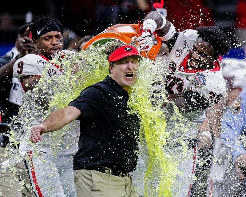 Georgia Bulldogs head coach Kirby Smart is showered with energy drink after his team defeated Baylor Bears in the Sugar Bowl at Mercedes-Benz Superdome in New Orleans on Wednesday, January 1. USA TODAY Sports