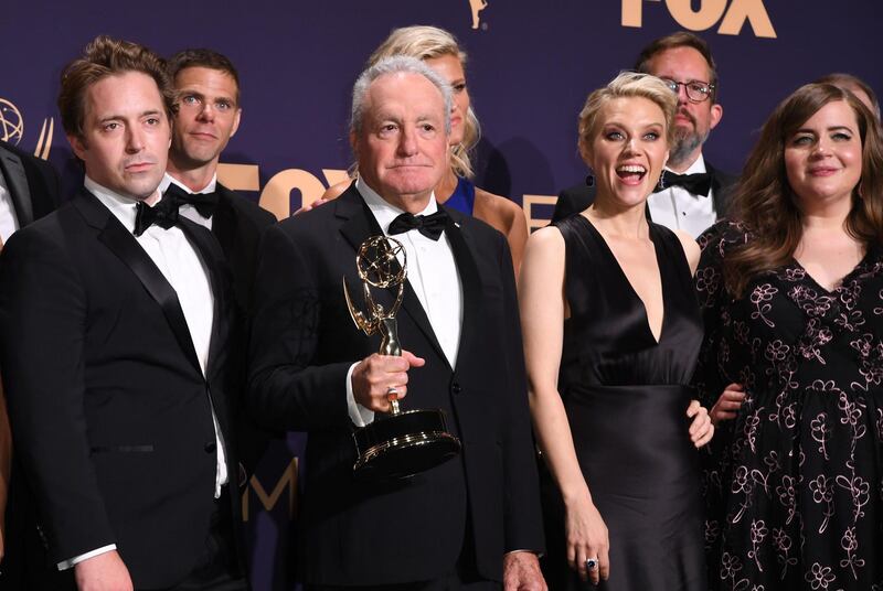 Producer Lorne Michaels and cast members pose with the Outstanding Variety Sketch Series award for 'Saturday Night Live' during the 71st Emmy Awards at the Microsoft Theatre in Los Angeles on September 22, 2019. AFP / Robyn Beck