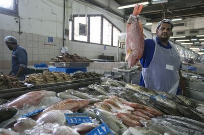 Indian trader Asif Kappil at the Mina Fish Market in Abu Dhabi. Mona Al Marzooqi / The National 
