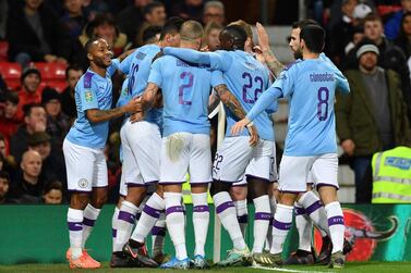 Manchester City midfielder Bernardo Silva is mobbed by teammates after scoring the opening goal at Old Trafford. AFP