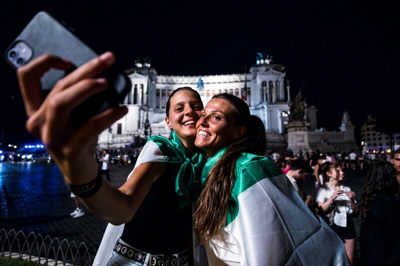 Italy fans celebrate at Piazza Venezia, Rome.