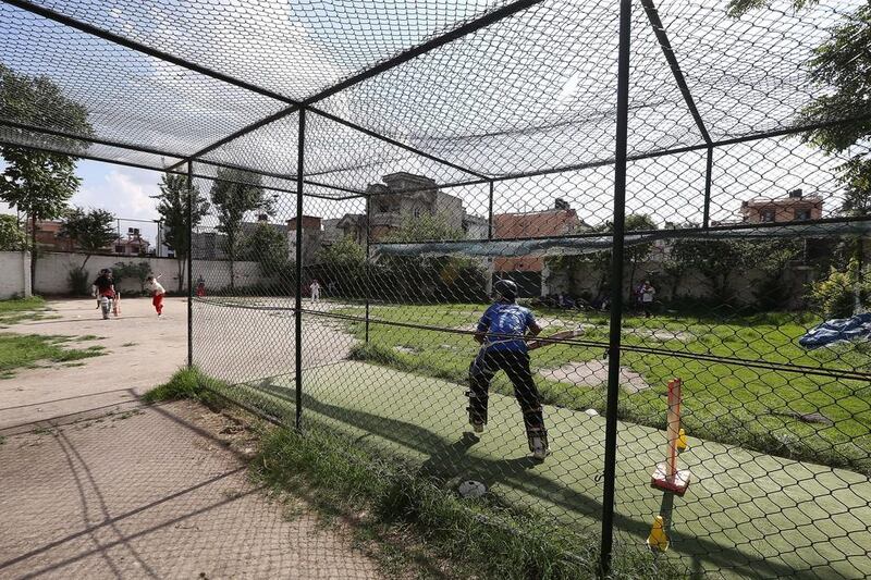 A cricketer participates in a nets session at the Baluwatar Cricket Club training centre in Kathmandu, Nepal. Pawan Singh / The National