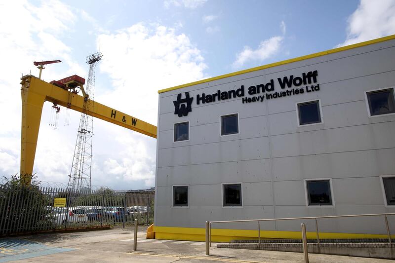 (FILES) In this file photo taken on August 05, 2019 a picture shows one of the cranes at the Harland and Wolff shipyard in Belfast. 

 The Belfast shipyard "Harland and Wolff", known for having built the Titanic, was on October 1, 2019, saved from bankruptcy thanks to its purchase for 6 million pounds (6.8 million euros) by the British energy infrastructure company Infrastrata. / AFP / PAUL FAITH
