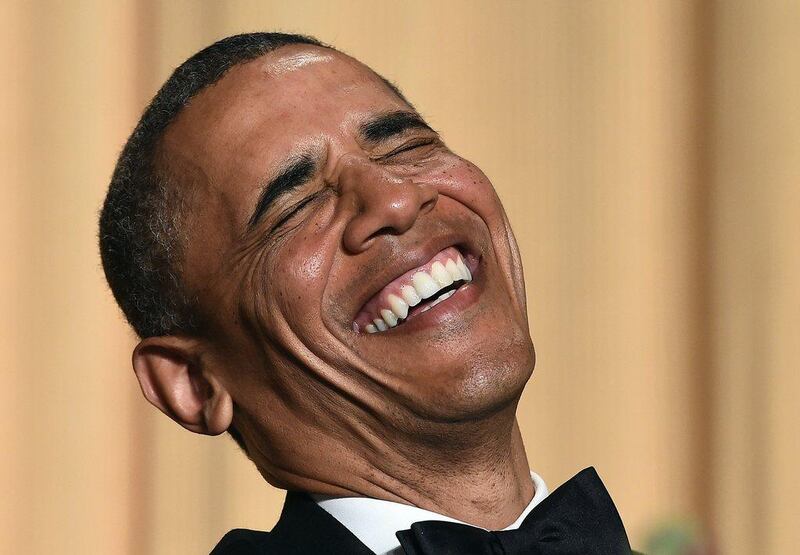  US President Barack Obama laughs as he listens performer Joel McHale telling jokes during the White House Correspondents’ Association Dinner. Jewel Samad / AFP Photo

