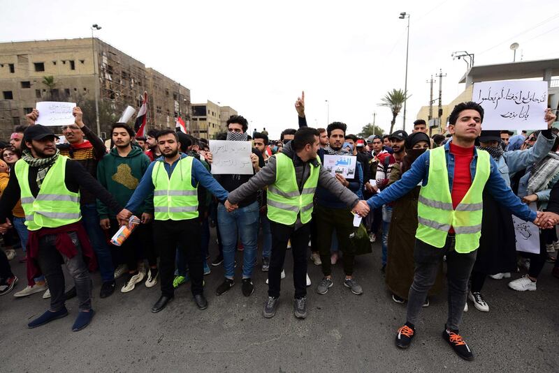 Iraqi university students chant slogans during a strike and protests in central Baghdad, Iraq.  EPA