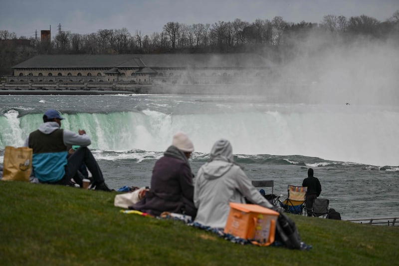 People gather at Niagara Falls State Park to view the eclipse in New York. AFP