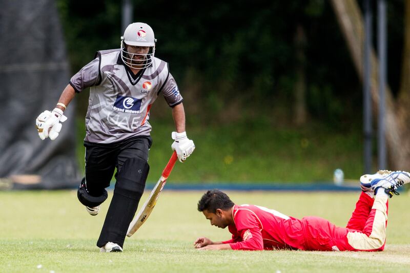 KING CITY, CANADA : August 6, 2013 UAE batsman Swapnil Patil chases down a run after Shaiman Anwar plays a shot past  from Canada bowler Junaid Siddiqui (right)  during the one day international  at the Maple Leaf Cricket club in King City, Ontario, Canada ( Chris Young/ The National). For Sports *** Local Caption ***  chy114.jpg