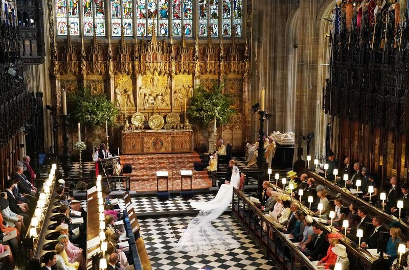 WINDSOR, UNITED KINGDOM - MAY 19:  Prince Harry and Meghan Markle exchange vows during their wedding ceremony in St George's Chapel at Windsor Castle on May 19, 2018 in Windsor, England. (Photo by Owen Humphreys - WPA Pool/Getty Images)