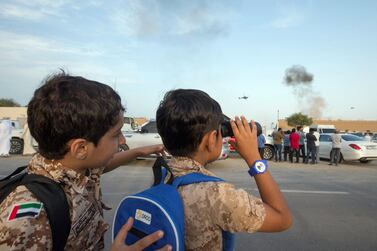 Children in military costume watching from the street of the Fourth Union Fortress, Fujairah. All photos by Leslie Pableo for The National