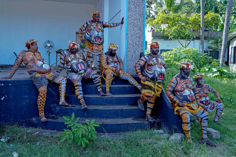 Tiger dancers wait to perform on the last day of Onam celebrations in Kochi, India. AFP

