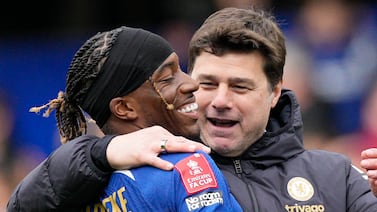 Chelsea's head coach Mauricio Pochettino celebrates with Chelsea's Noni Madueke after the FA Cup quarterfinal soccer match between Chelsea and Leicester City at Stamford Bridge in London, Sunday, March 17, 2024.  Chelsea won the match 4-2.  (AP Photo / Dave Shopland)