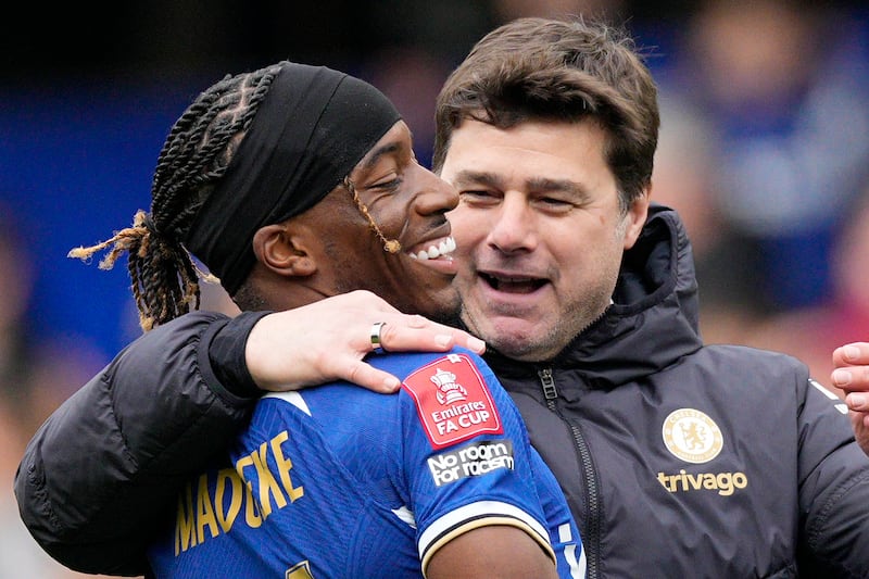 Chelsea manager Mauricio Pochettino celebrates with Noni Madueke after their 4-2 FA Cup quarter-final win over Leicester City at Stamford Bridge on March 17, 2024. AP