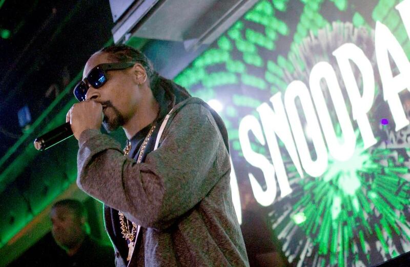 The controversial Snoop Dogg has been quietly involved in children's development through sports. Tyler Curtis / AP Photo