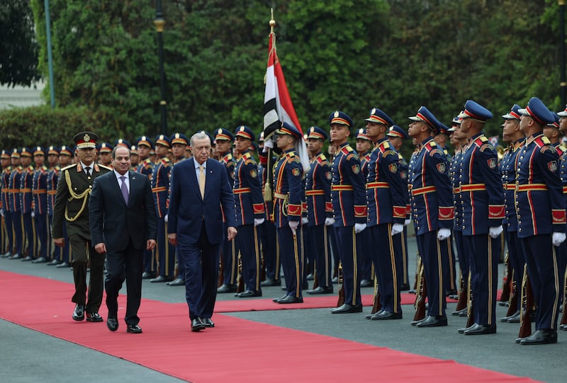 Mr Erdogan, right, reviewed a guard of honour with Mr El Sisi before their talks at Al Ittihadiya Palace in Cairo. AP