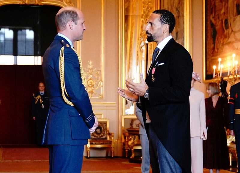 Former soccer player Rio Ferdinand is made an Officer of the Order of the British Empire by Prince William at Windsor Castle on Tuesday. PA