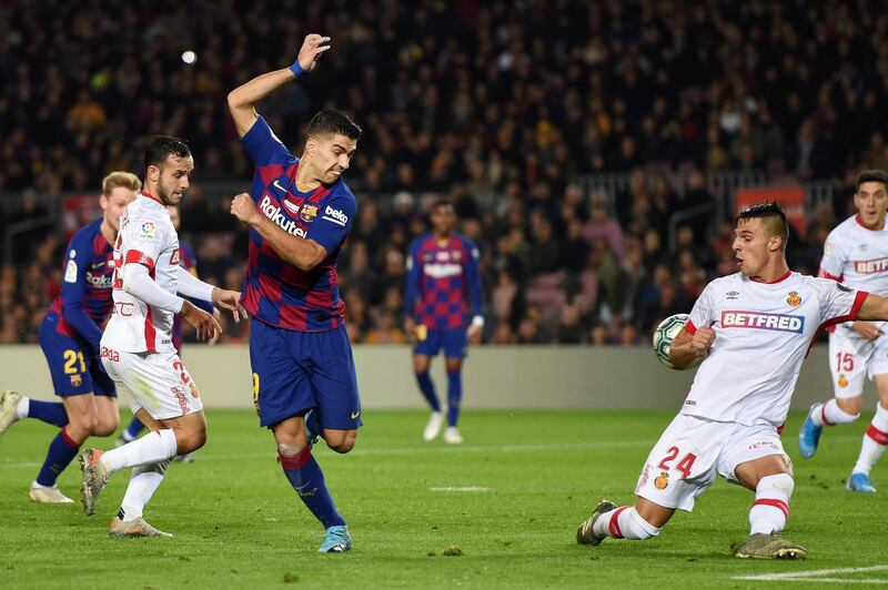 Luis Suarez scores his incredible backheeled goal. Getty