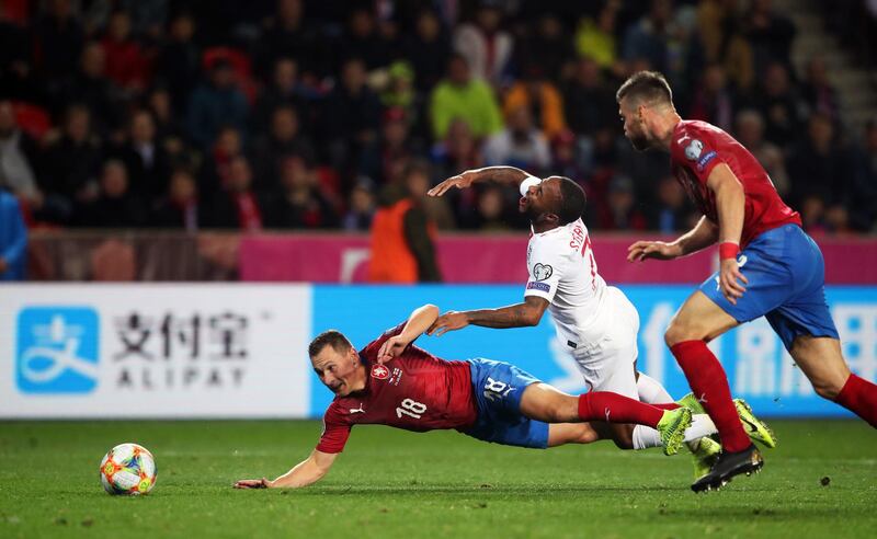 Czech Republic's Jan Boril (left) and England's Raheem Sterling battle for the ball during the UEFA Euro 2020 qualifying, Group A match at Sinobo Stadium, Prague. PA Photo.