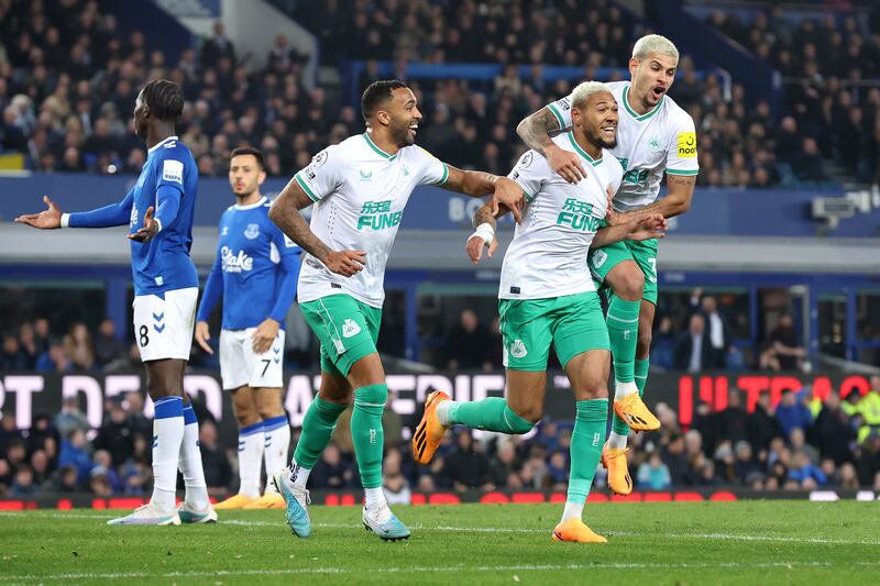 Joelinton celebrates with teammates Callum Wilson and Bruno Guimaraes after scoring the Newcastle United's second goal in their 4-1 Premier League win over Everton at Goodison Park, on April 27, 2023. Getty