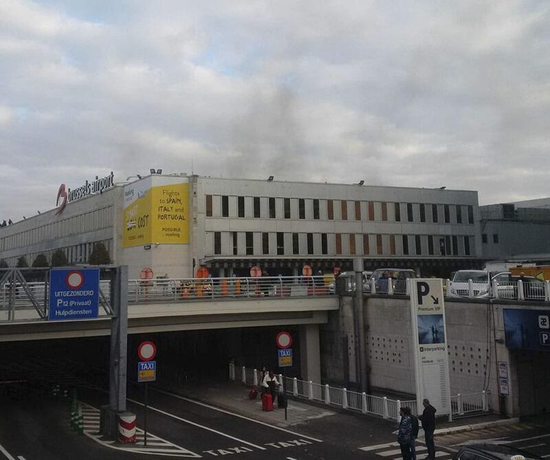 Smoke is seen at Brussels airport in Brussels, Belgium, after explosions were heard Tuesday. Daniela Schwarzer via AP