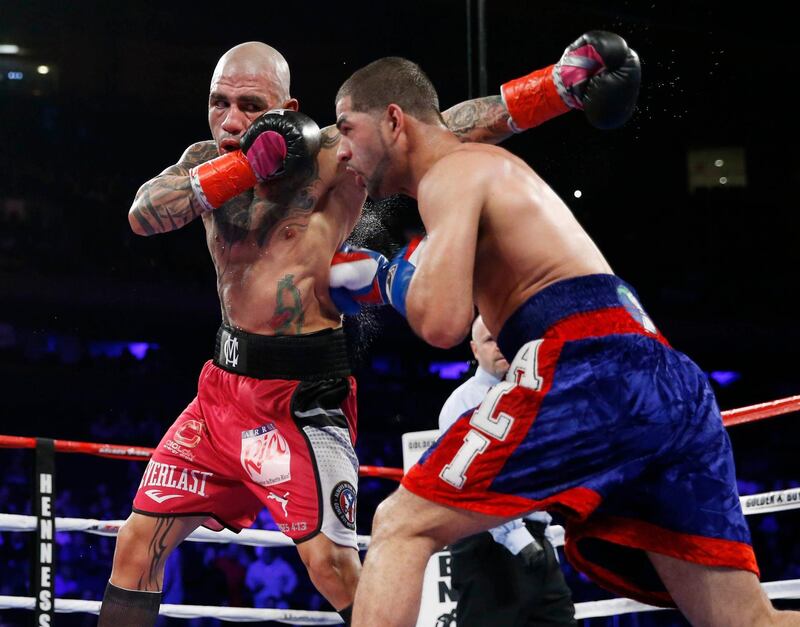 Dec 2, 2017; New York, NY, USA; Miguel Cotto (red trunks) and Sadam Ali during the WBO junior middle weight world championship boxing fight at Madison Square Garden. Mandatory Credit: Noah K. Murray-USA TODAY Sports