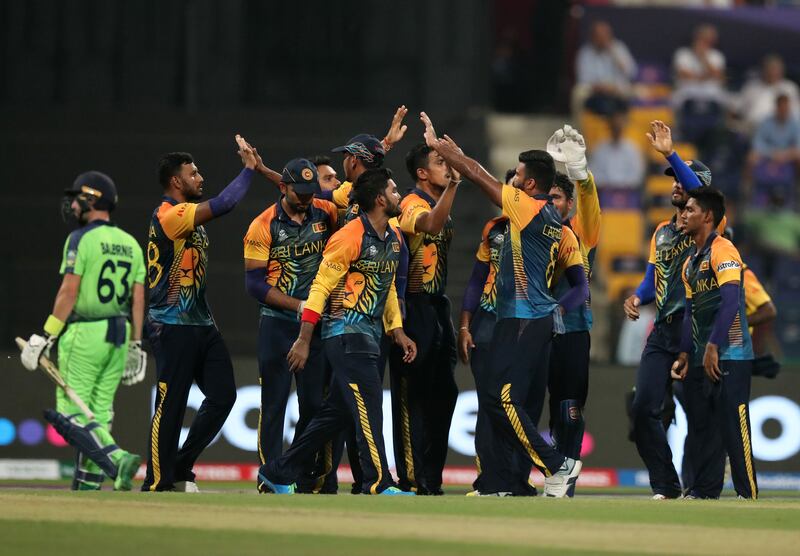 Sri Lanka's Lahiru Kumara takes the wicket of Ireland's Andy Balbirnie in their T20 World Cup first round match at the Zayed Cricket Stadium in Abu Dhabi on Wednesday, October 20, 2021. Chris Whiteoak / The National